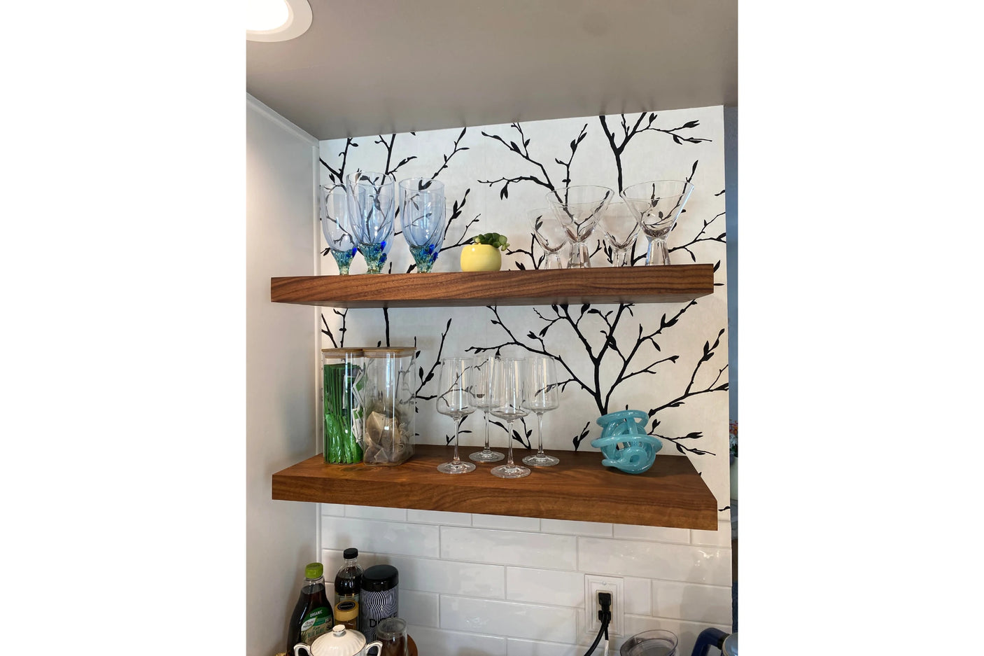 Walnut kitchen shelves and wallpaper