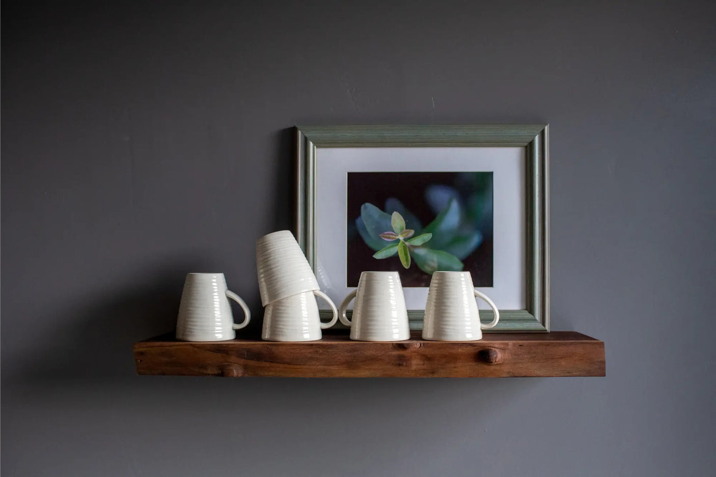 live edge walnut floating shelf with mugs