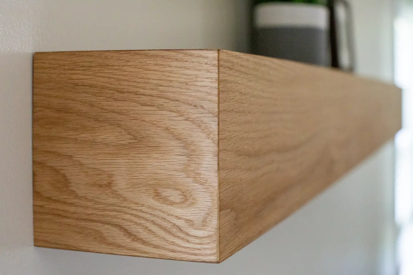 White oak box mantel with decorations