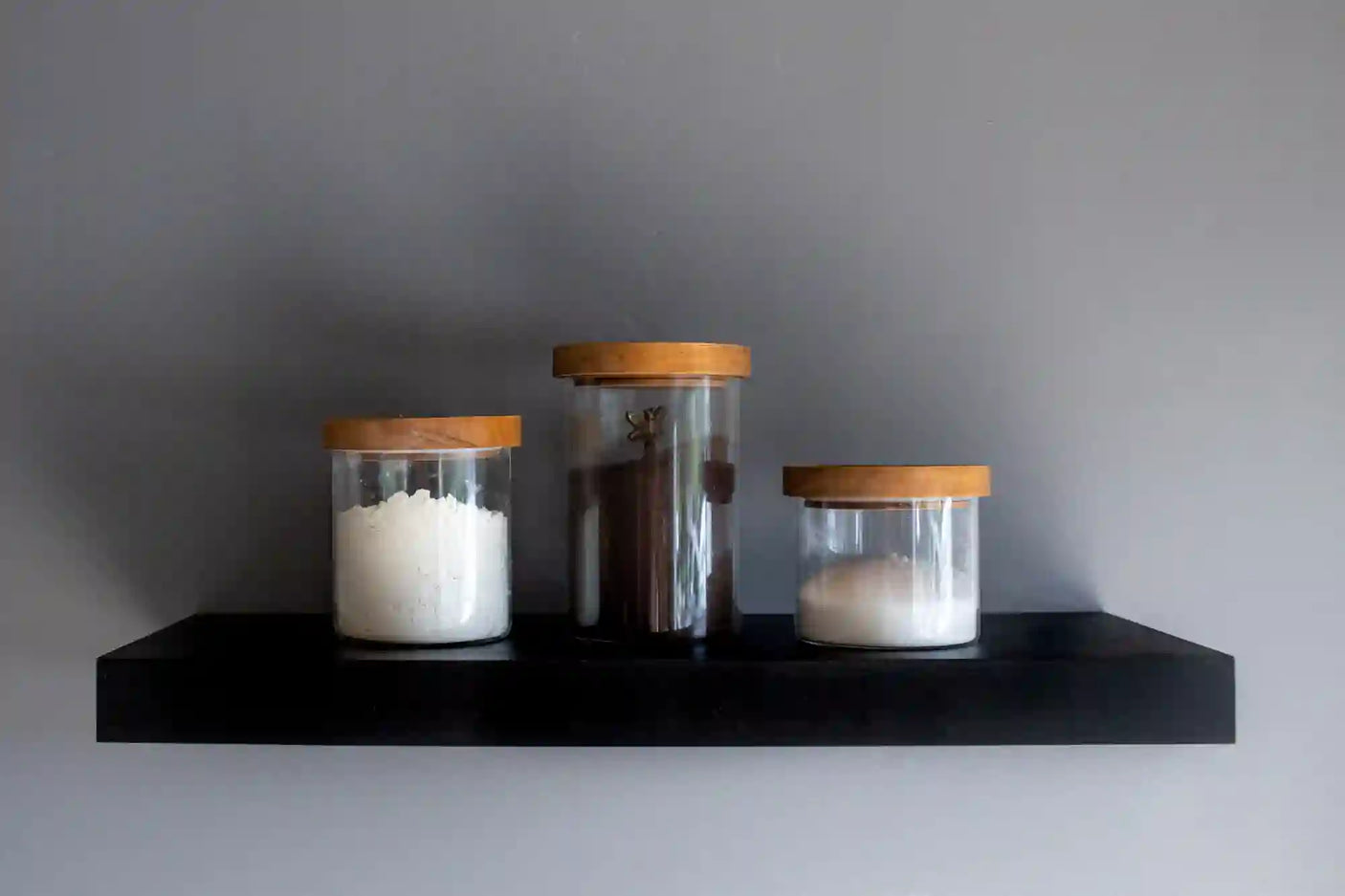 Black heavy duty floating shelves with flower