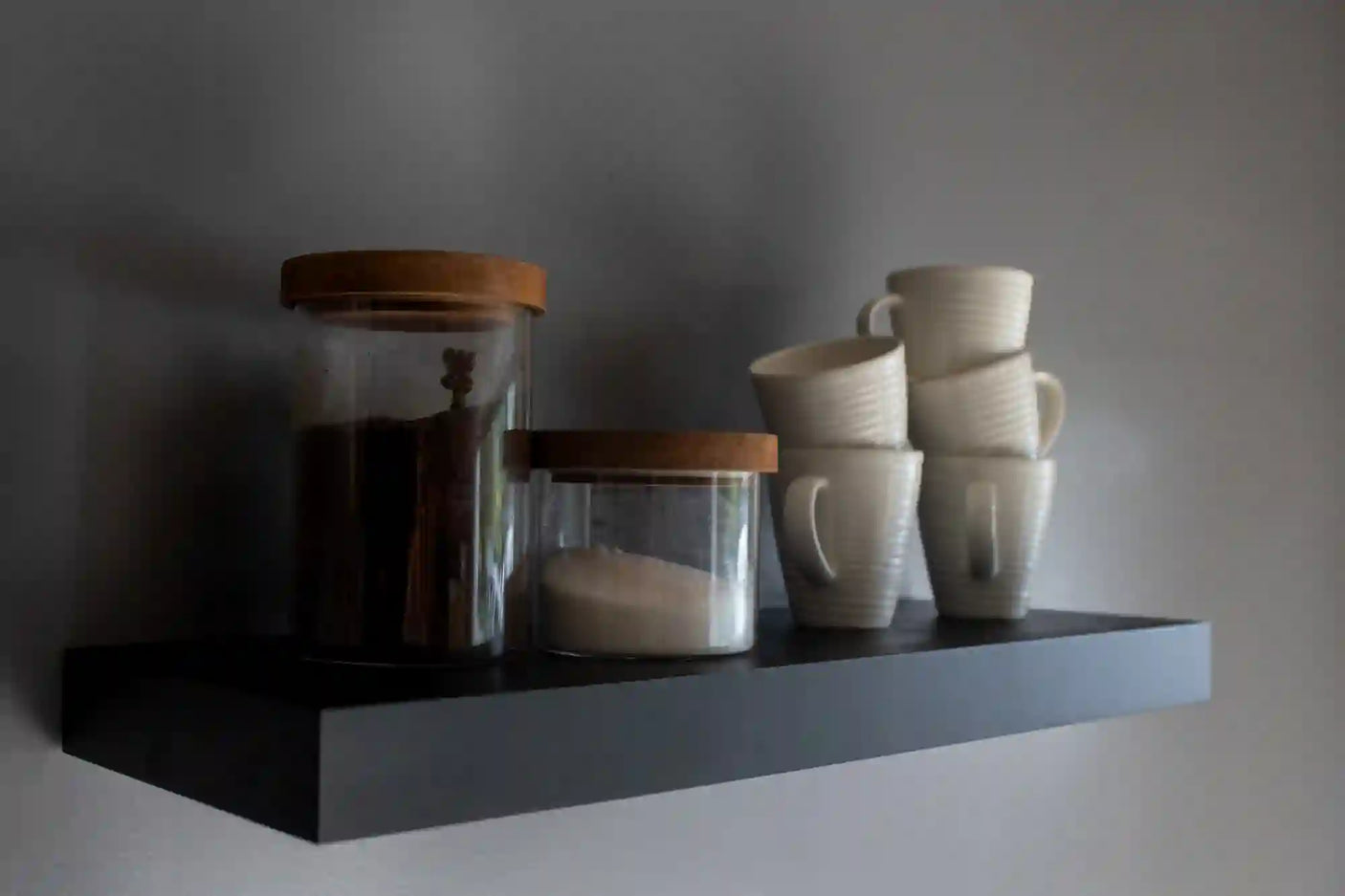 Black heavy duty floating shelves with flower