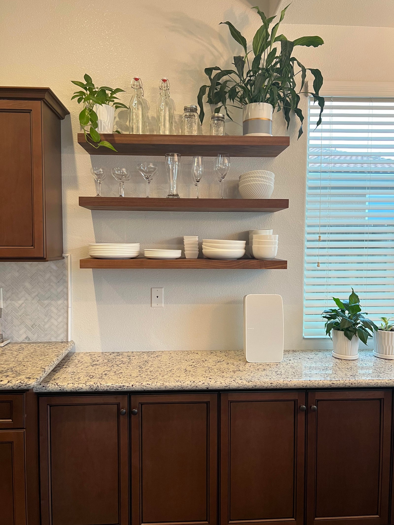 Walnut floating shelves in kitchen