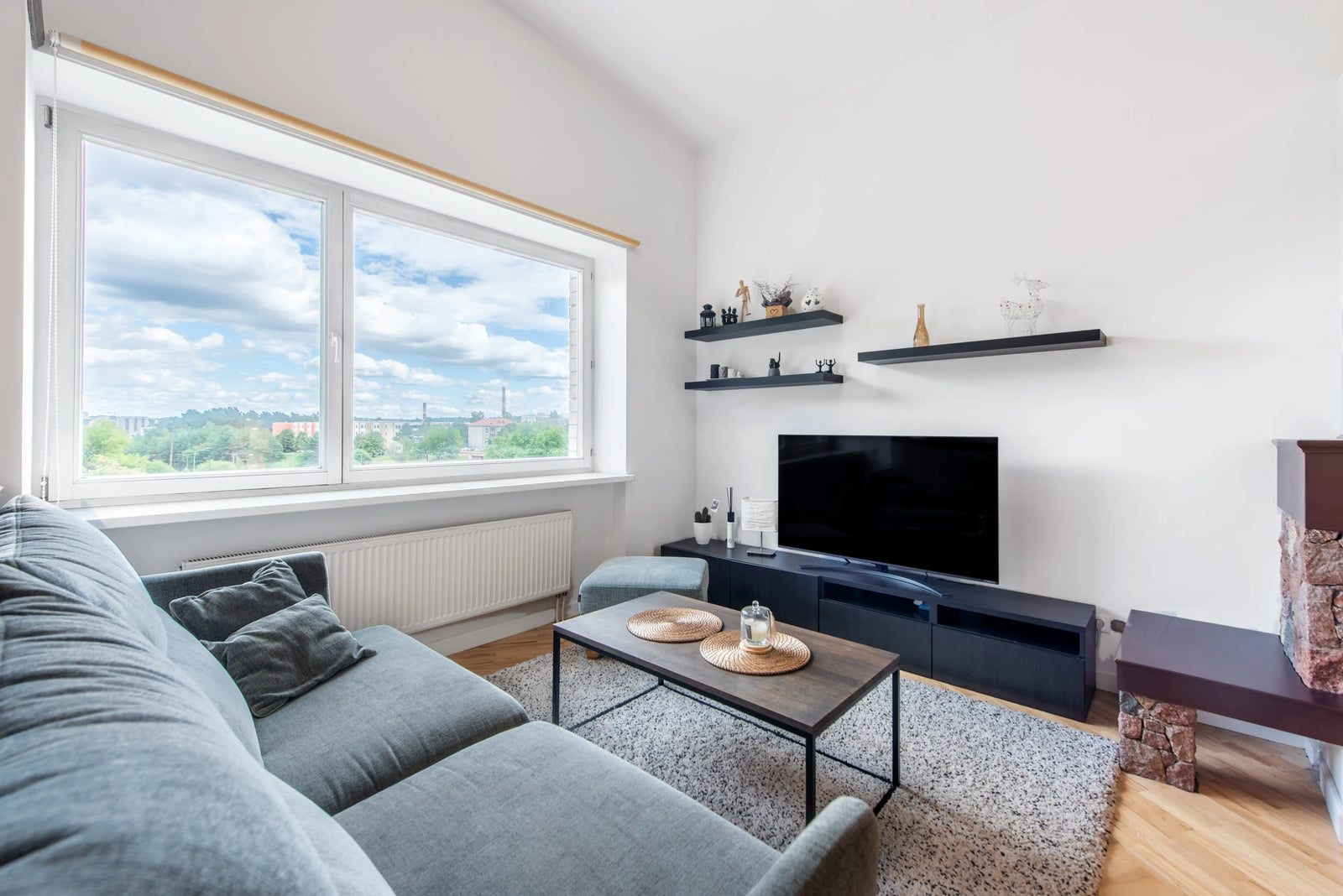 Floating shelves above TV