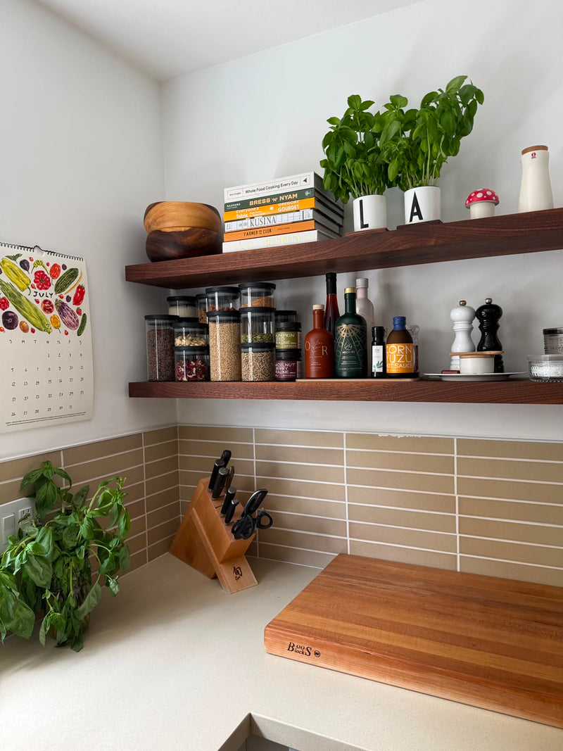 Walnut floating shelves with spices and cookbooks